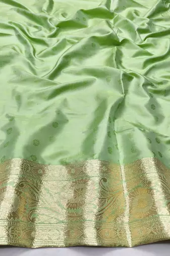 Light green zari woven banarasi silk traditional saree with blouse piece