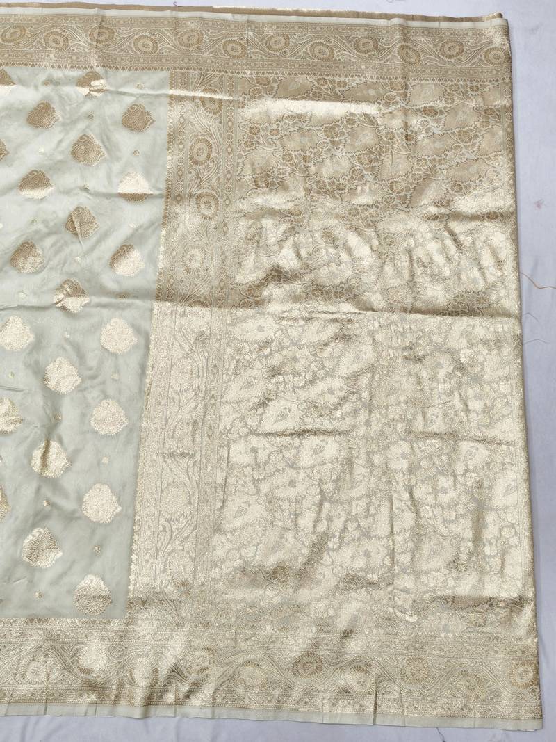 Cream zari woven banarasi silk traditional saree with blouse piece