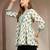Off-white floral printed cotton flared top for women