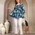 Sky-blue floral printed cotton flared top for women