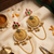 gold-plated antique matte chandbali kashmiri earrings with red and green multi-stones