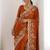 Rust colour party wear rangoli silk embroidered saree