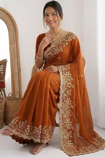 Rust colour party wear rangoli silk embroidered saree