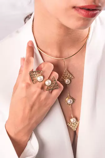 golden brass necklace set with pearl geometric design