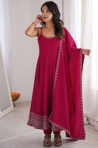 Graceful rani pink Silk blend anarkali gown with embroidered border and matching dupatta
