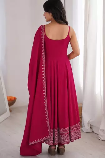 Graceful rani pink Silk blend anarkali gown with embroidered border and matching dupatta