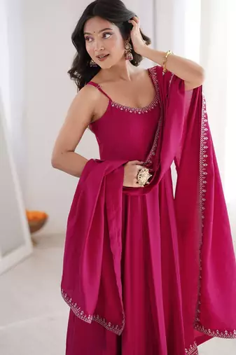 Graceful rani pink Silk blend anarkali gown with embroidered border and matching dupatta