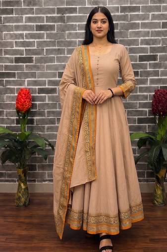 New trendy stylish cream solid anarkali kurta with traditional golden border dupatta set