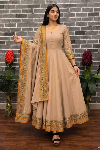 New trendy stylish cream solid anarkali kurta with traditional golden border dupatta set