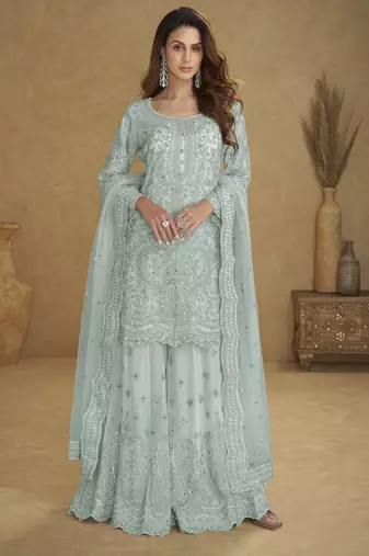 Blue net free size stitched suit with embroidery & hand work