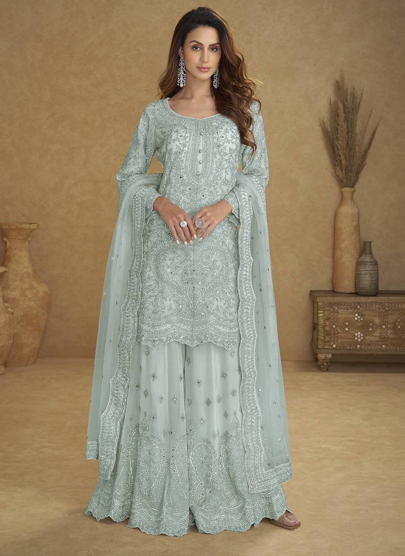 Blue net free size stitched suit with embroidery & hand work
