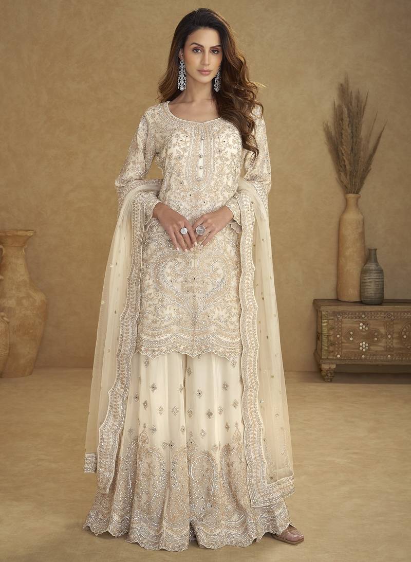 White net free size stitched suit with embroidery & hand work