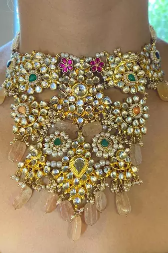 The grand floral multi-color kundan necklace & earring sets