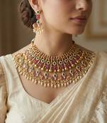 The opulent ruby emerald kundan set
