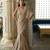 Champagne gold embroidered tissue pre drape saree set