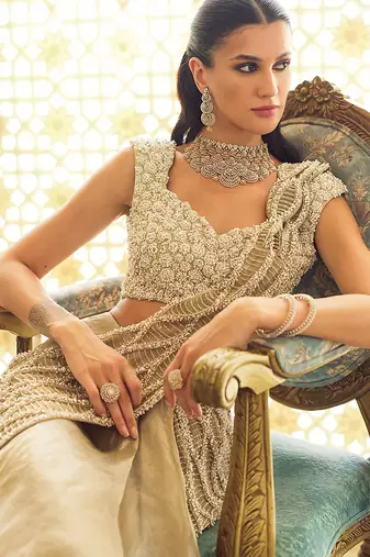 Light gold ruffle embroidered tissue pre drape saree set