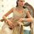 Light gold ruffle embroidered tissue pre drape saree set