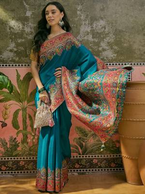Teal position print with zari weaving saree with contrast blouse piece 4
