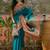 Teal position print with zari weaving saree with contrast blouse piece