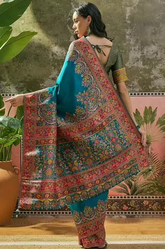 Teal position print with zari weaving saree with contrast blouse piece