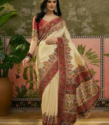 Off white position print with zari weaving saree with contrast blouse piece