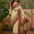 Off white position print with zari weaving saree with contrast blouse piece