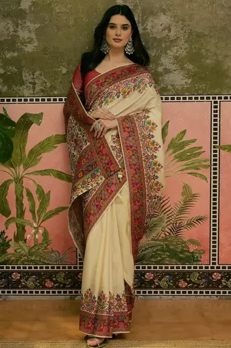 Off white position print with zari weaving saree with contrast blouse piece
