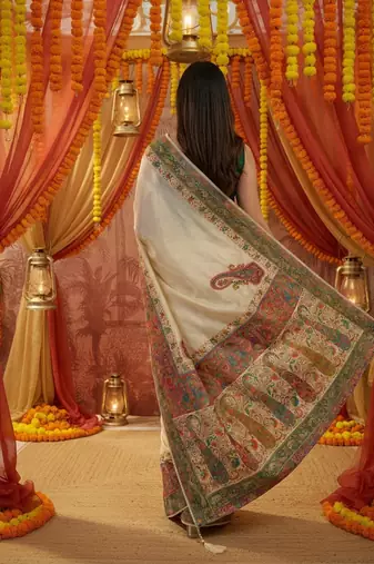 Off white viscose silk position print saree with contrast blouse piece