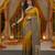 Mustard viscose silk position print saree with contrast blouse piece