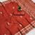 Rust satin with zari embrodery work saree with unstitched blouse piece