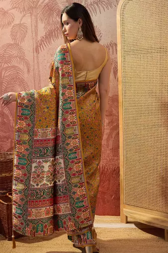 Mustard viscose silk position print saree with contrast blouse piece