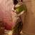 Green viscose silk position print saree with contrast blouse piece