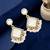 Gold plated square shape white earrings