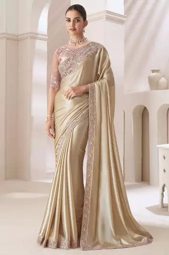 Light golden embroidery fancy fabric party wear saree with blouse piece
