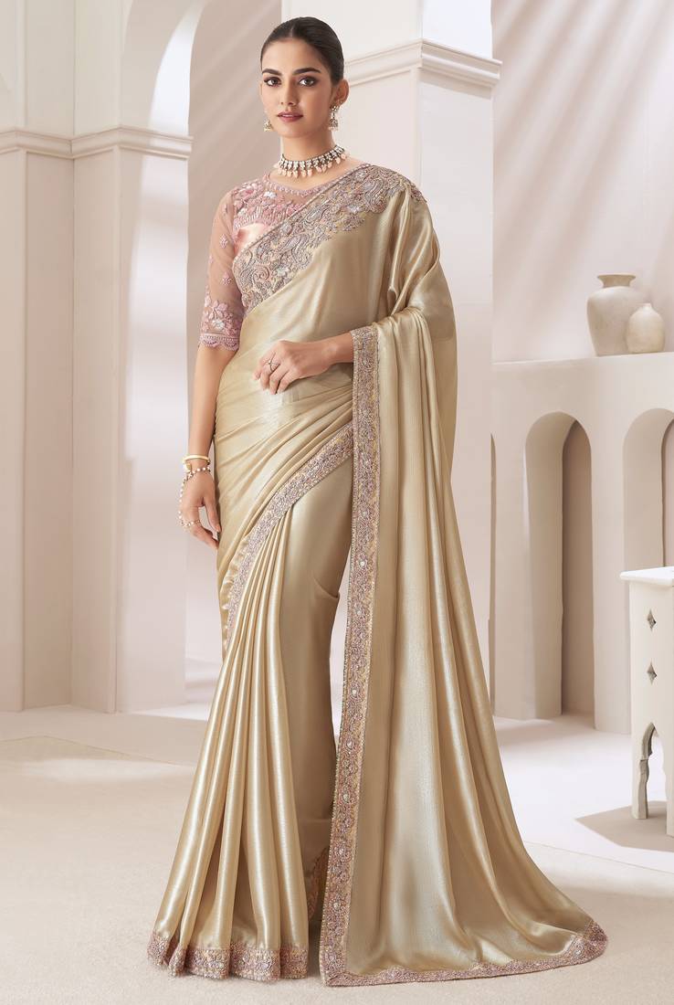 Light golden embroidery fency fabric party wear saree with blouse piece