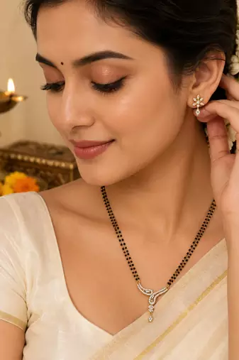 Double strand black bead mangalsutra with cz stone gold-toned pendant, traditional indian jewellery