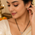 Double strand black bead mangalsutra with cz stone gold-toned pendant, traditional indian jewellery