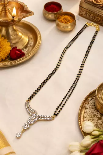 Double strand black bead mangalsutra with cz stone gold-toned pendant, traditional indian jewellery