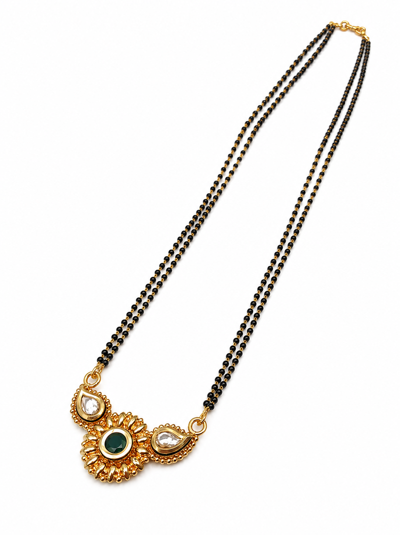 Traditional mangalsutra with double strand black beads, gold-toned kundan pendant, green stone