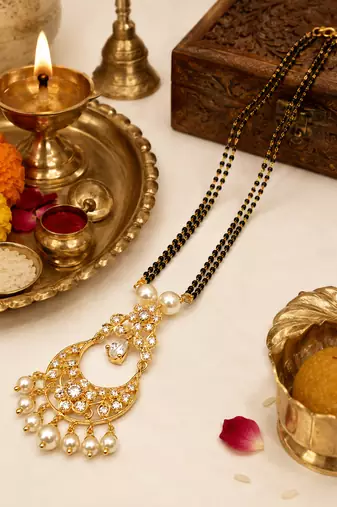 Gold-toned double strand black bead mangalsutra with chandbali pendant, pearl and kundan embellishments