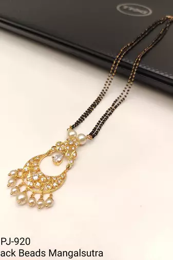 Gold-toned double strand black bead mangalsutra with chandbali pendant, pearl and kundan embellishments