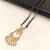 Gold-toned double strand black bead mangalsutra with chandbali pendant, pearl and kundan embellishments