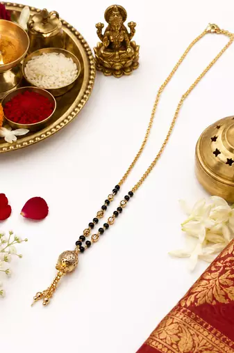 Gold-plated mangalsutra with black beads, long chain, filigree ball pendant with tassel, traditional indian jewellery