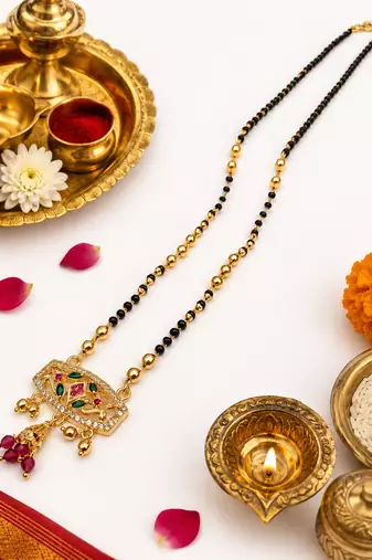 Traditional gold-plated mangalsutra with black beads, multicolour stone pendant and ruby drops