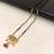 Traditional gold-plated mangalsutra with black beads, multicolour stone pendant and ruby drops