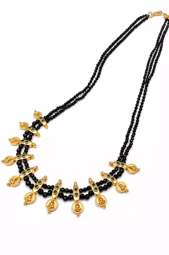 Traditional black beaded mangalsutra necklace, gold-toned, triple strand, lakshmi coin charms, green stone accents