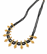 Traditional black beaded mangalsutra necklace, gold-toned, triple strand, lakshmi coin charms, green stone accents