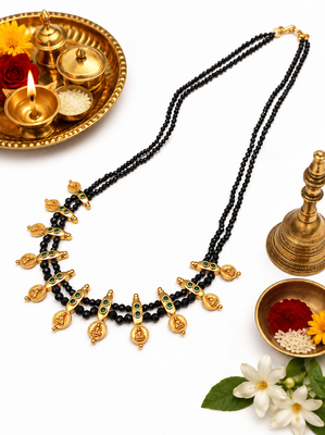 Traditional black beaded mangalsutra necklace, gold-toned, triple strand, lakshmi coin charms, green stone accents 3