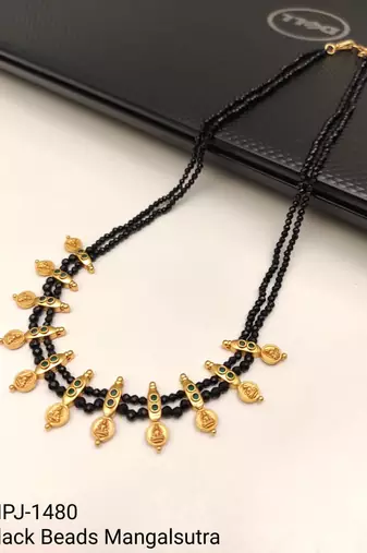 Traditional black beaded mangalsutra necklace, gold-toned, triple strand, lakshmi coin charms, green stone accents