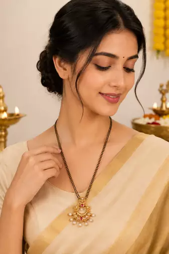 Traditional long mangalsutra with double black bead chain, gold-toned kundan ruby pearl pendant